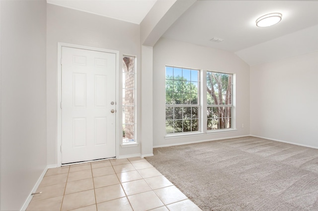 tiled entrance foyer with lofted ceiling