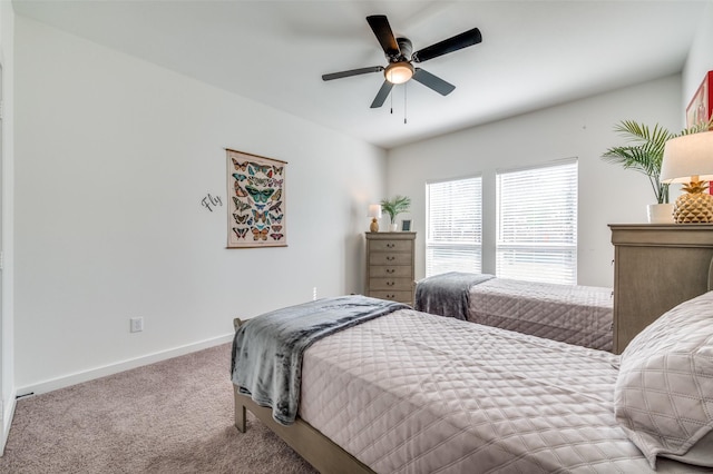 bedroom featuring carpet floors, baseboards, and a ceiling fan