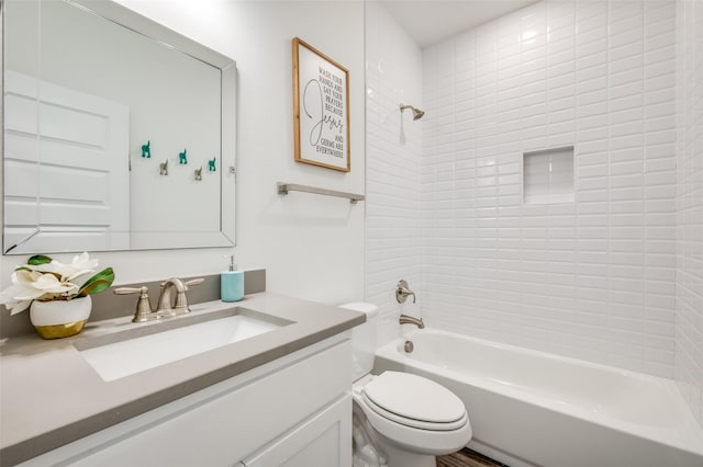 bathroom with toilet, tub / shower combination, and vanity