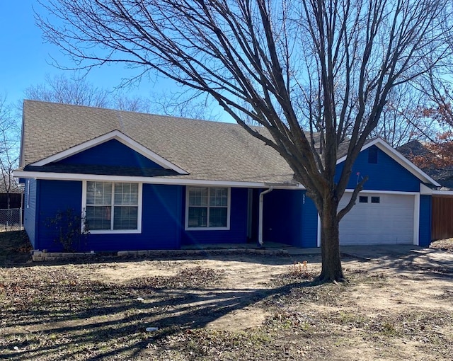 ranch-style home with a garage