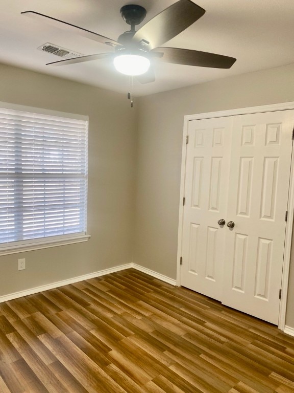 spare room featuring ceiling fan and hardwood / wood-style flooring