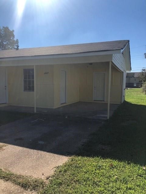 exterior space with a carport