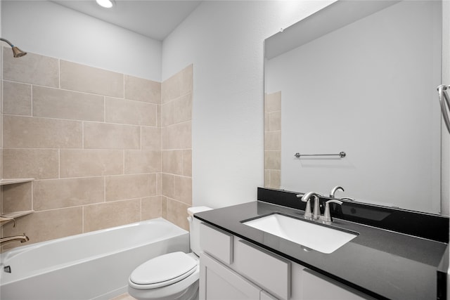 full bathroom with toilet, tiled shower / bath, and vanity