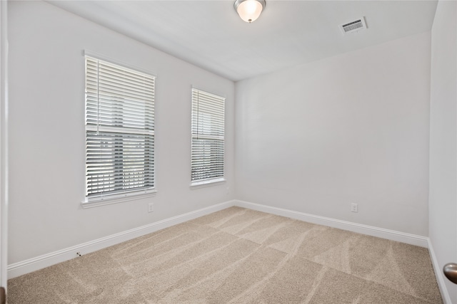 unfurnished room with carpet floors