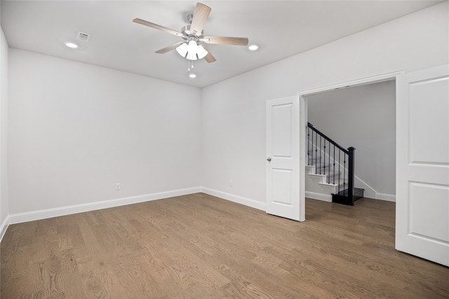 unfurnished room with ceiling fan and hardwood / wood-style flooring