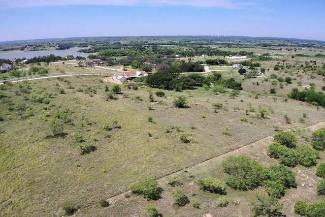 birds eye view of property with a rural view