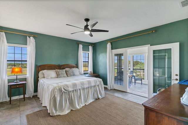 bedroom with multiple windows, french doors, access to exterior, and ceiling fan