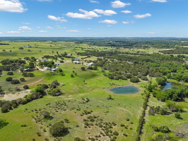 bird's eye view featuring a rural view and a water view