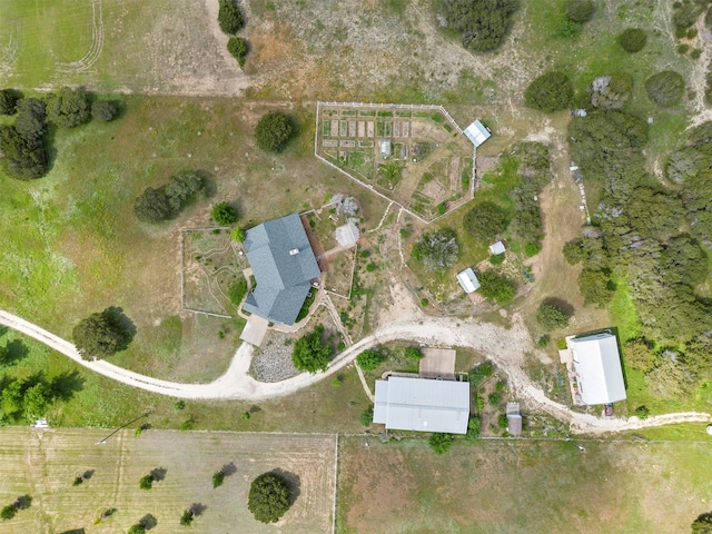 birds eye view of property with a rural view