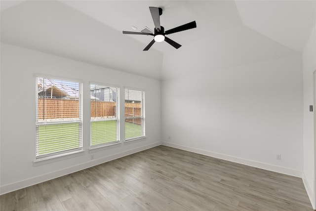 unfurnished room featuring lofted ceiling, ceiling fan, and light wood-type flooring