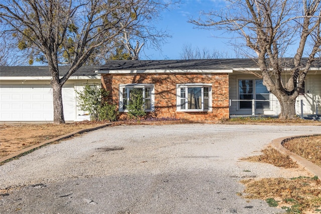 single story home featuring a garage