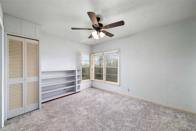 unfurnished bedroom with ceiling fan, light colored carpet, and a closet