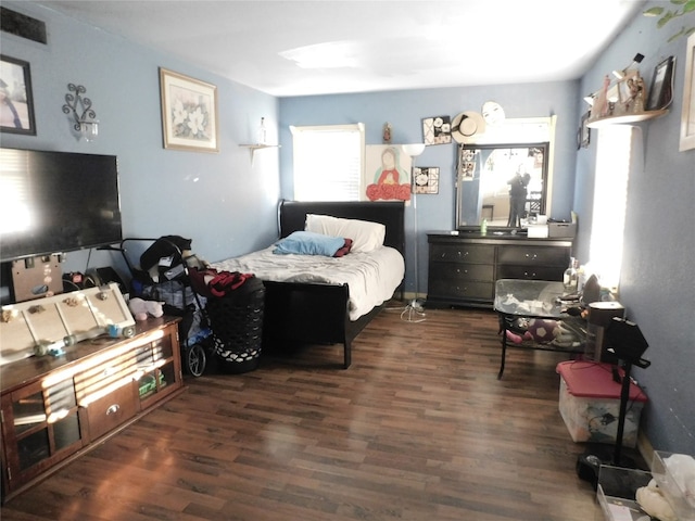 bedroom featuring dark hardwood / wood-style floors