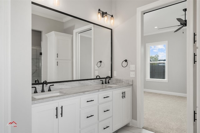 bathroom featuring crown molding, vanity, and ceiling fan