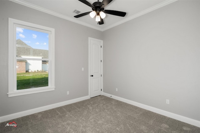 carpeted spare room featuring ceiling fan and ornamental molding