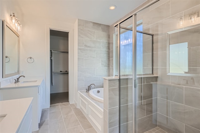 bathroom with separate shower and tub, vanity, tile walls, and tile patterned flooring