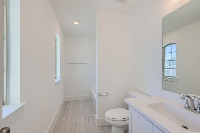 bathroom with toilet and vanity