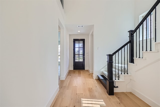 entryway with light hardwood / wood-style flooring