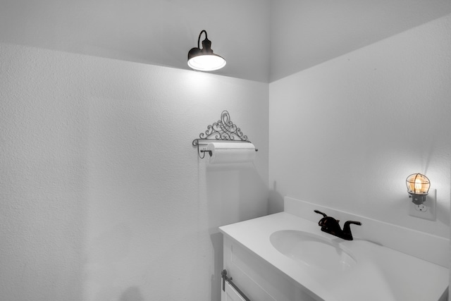 kitchen with ceiling fan, beamed ceiling, white cabinets, sink, and dishwasher