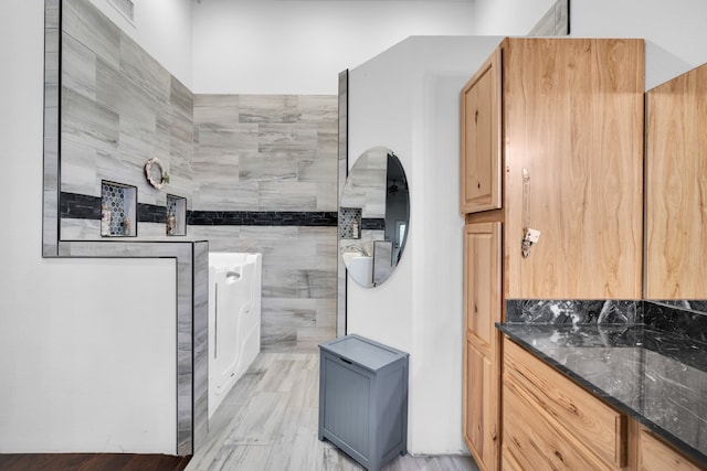 bathroom with tile flooring and vanity