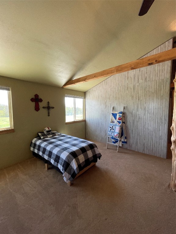 bedroom with carpet, ceiling fan, and lofted ceiling