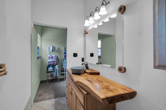 bathroom with tile flooring and oversized vanity