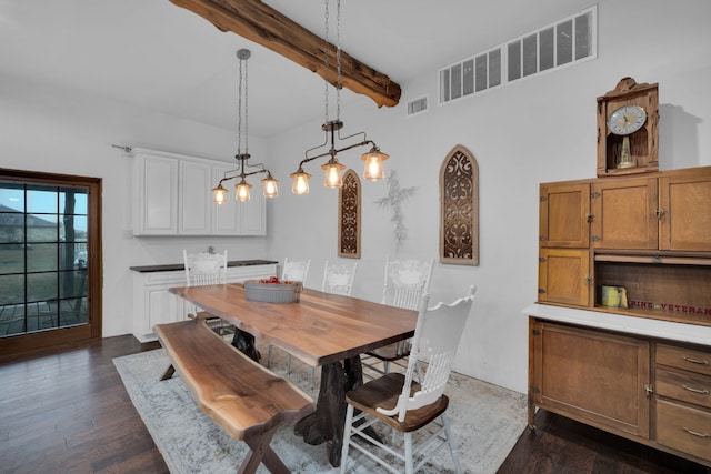 living room featuring beamed ceiling, dark hardwood / wood-style flooring, a barn door, and ceiling fan