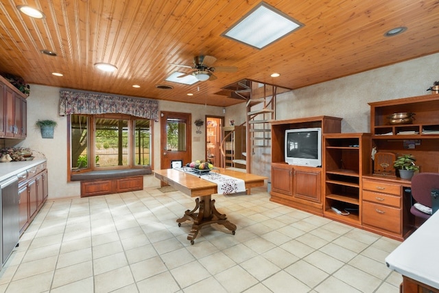 interior space featuring wood ceiling, ceiling fan, and light tile floors