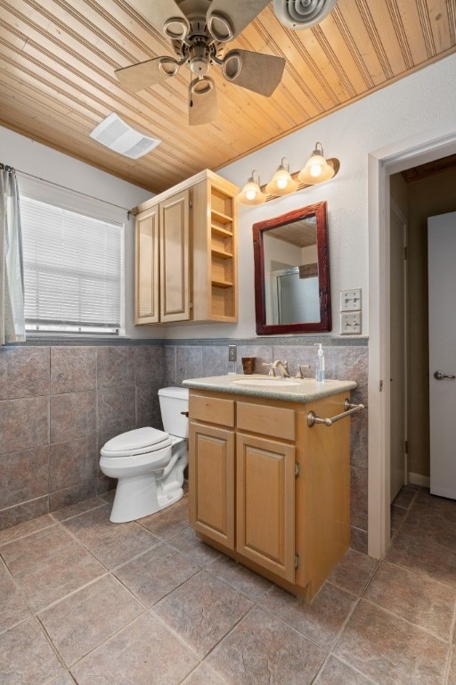 bathroom featuring tile walls, ceiling fan, wood ceiling, and toilet