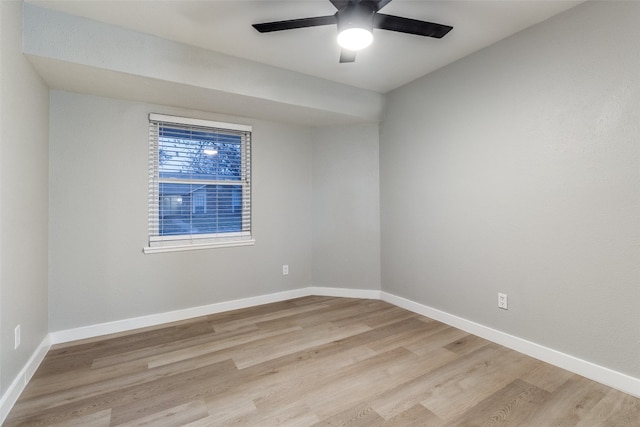 spare room with light hardwood / wood-style floors and ceiling fan