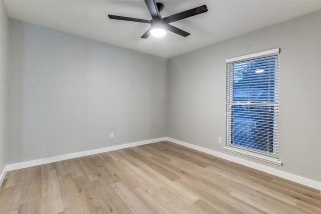 unfurnished room with light wood-type flooring and ceiling fan