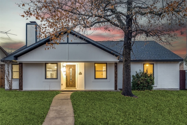 view of front of home featuring a yard