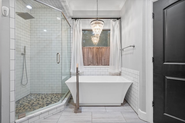 bathroom with crown molding, a chandelier, and plus walk in shower