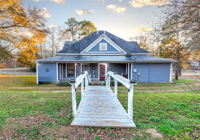 view of front facade with a porch and a front lawn