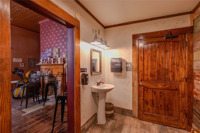 bathroom with hardwood / wood-style floors and ornamental molding