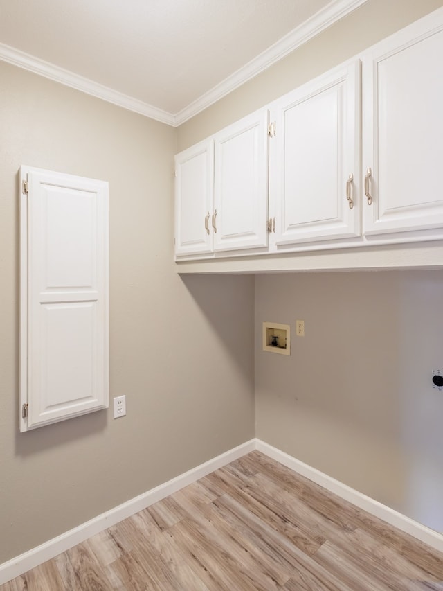 laundry room with hookup for a washing machine, hookup for an electric dryer, light wood-type flooring, cabinets, and ornamental molding