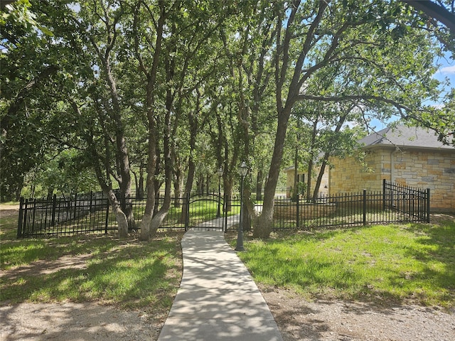 view of home's community featuring a lawn