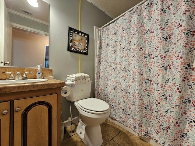 bathroom featuring tile patterned floors, vanity, toilet, and ornamental molding