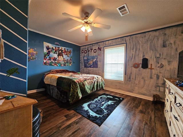 bedroom with dark hardwood / wood-style flooring, ceiling fan, and crown molding