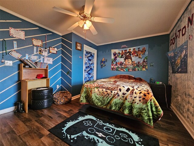 bedroom with hardwood / wood-style floors, ceiling fan, and crown molding