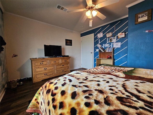 bedroom featuring ceiling fan, dark hardwood / wood-style floors, and ornamental molding