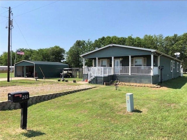 view of front of property with covered porch, a front lawn, and a carport