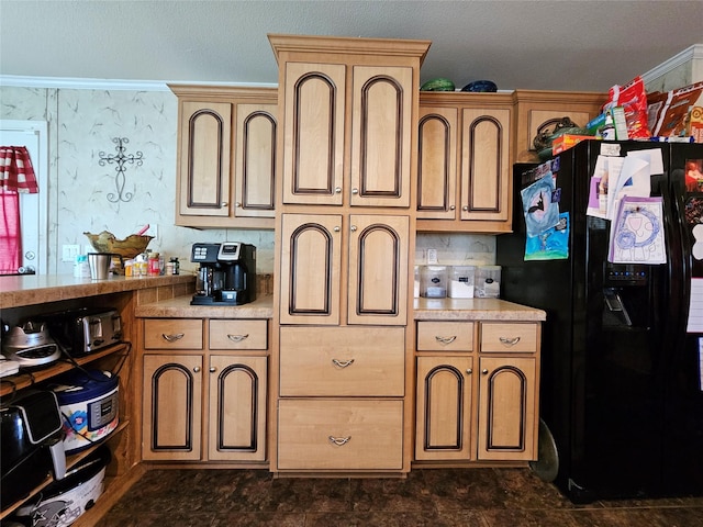 kitchen featuring black fridge with ice dispenser and ornamental molding