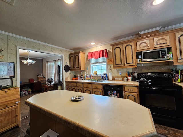 kitchen with a center island, black appliances, sink, ornamental molding, and a notable chandelier