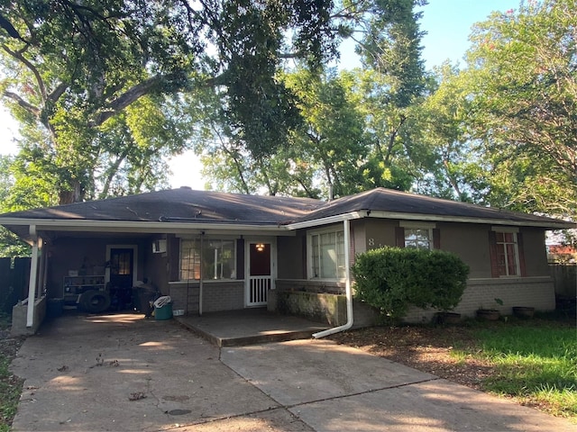 ranch-style home with a carport