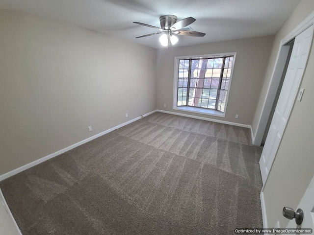 carpeted empty room with ceiling fan