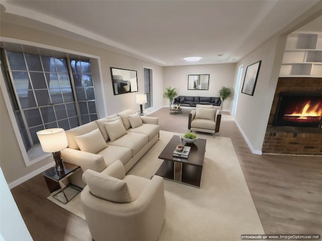 living room featuring wood-type flooring and a brick fireplace