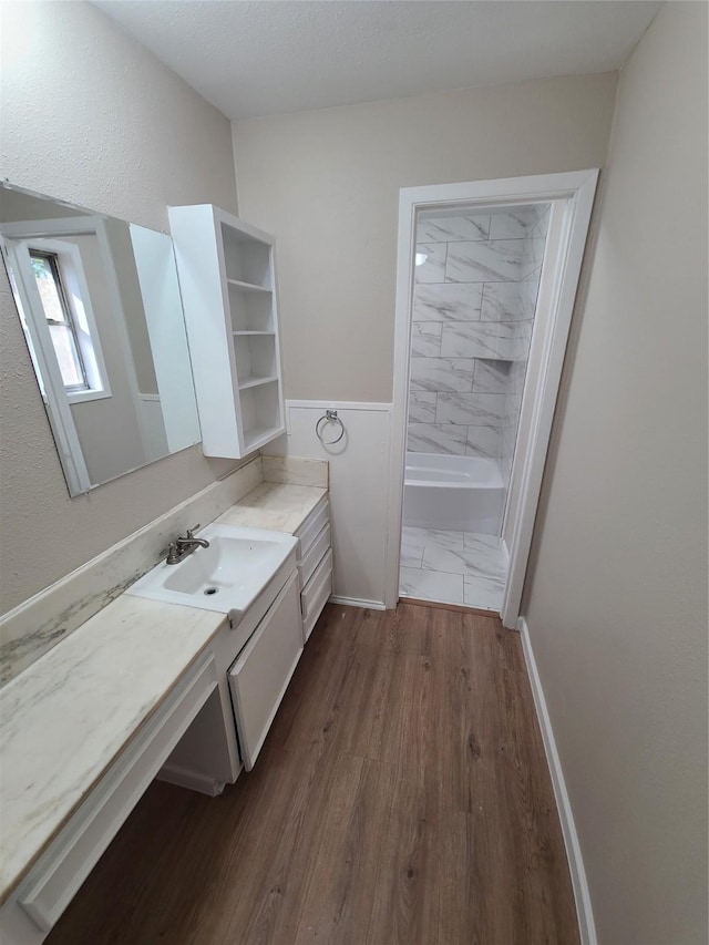 bathroom featuring vanity and hardwood / wood-style flooring