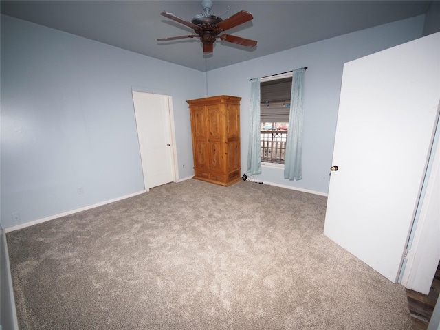 unfurnished bedroom featuring carpet and ceiling fan