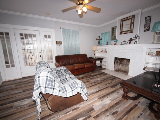 living room with crown molding, dark hardwood / wood-style flooring, and ceiling fan